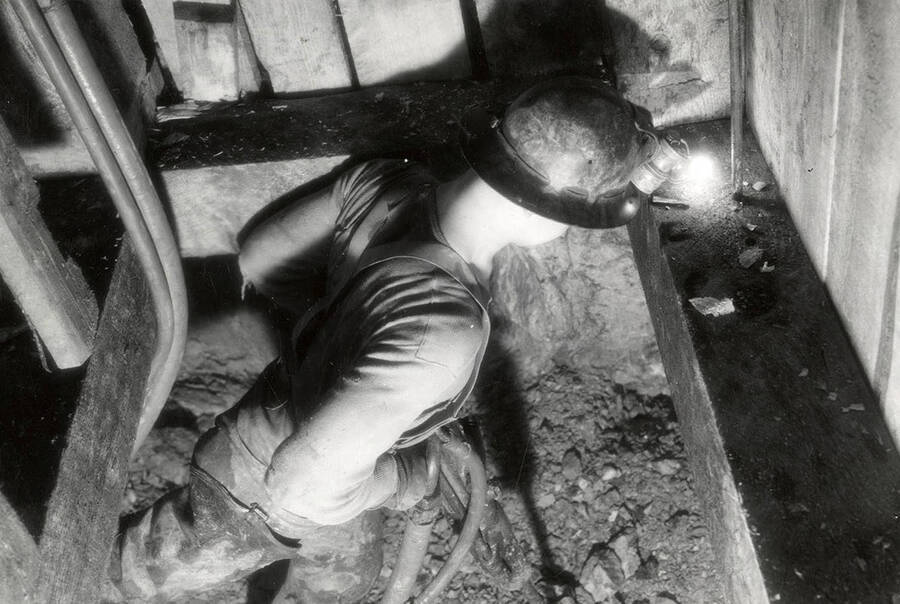A man drilling in the Silver Dollar Mine in Osburn, Idaho.