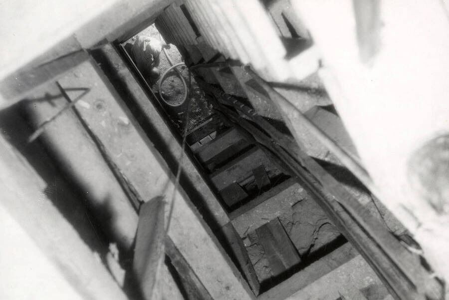 View looking down the shaft at a worker who is underground at the Silver Dollar Mine in Osburn, Idaho.