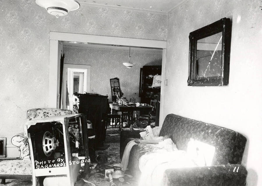 Interior view of the damage to a house, caused by the sunshine powder magazine explosion at the mouth of Big Creek.