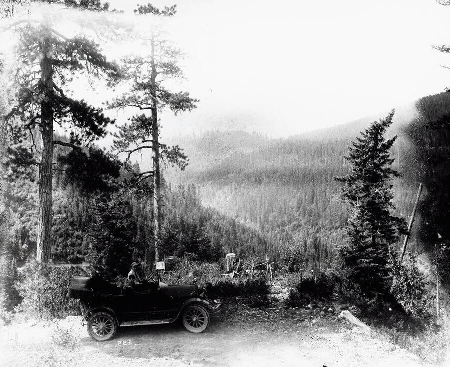 View between Tamarack and Interstate (mines not shown). Image also shows a man and a young boy sitting in a car at the side of the road.