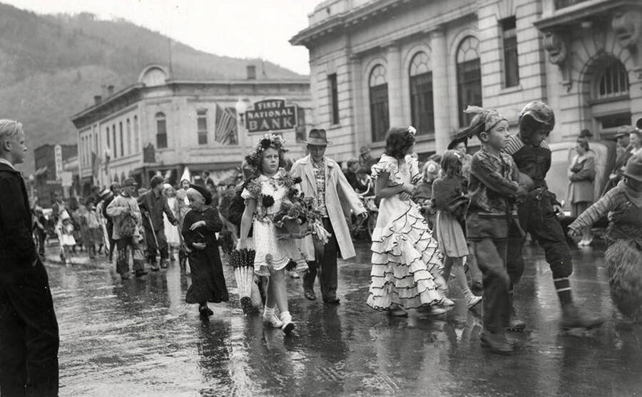 Children, who are in costume, walking in the Elks parade in Wallace, Idaho.