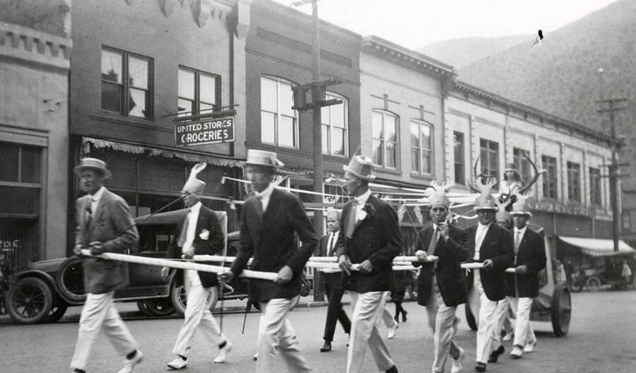 A group of men pulling a float in the Elks parade in Wallace, Idaho.