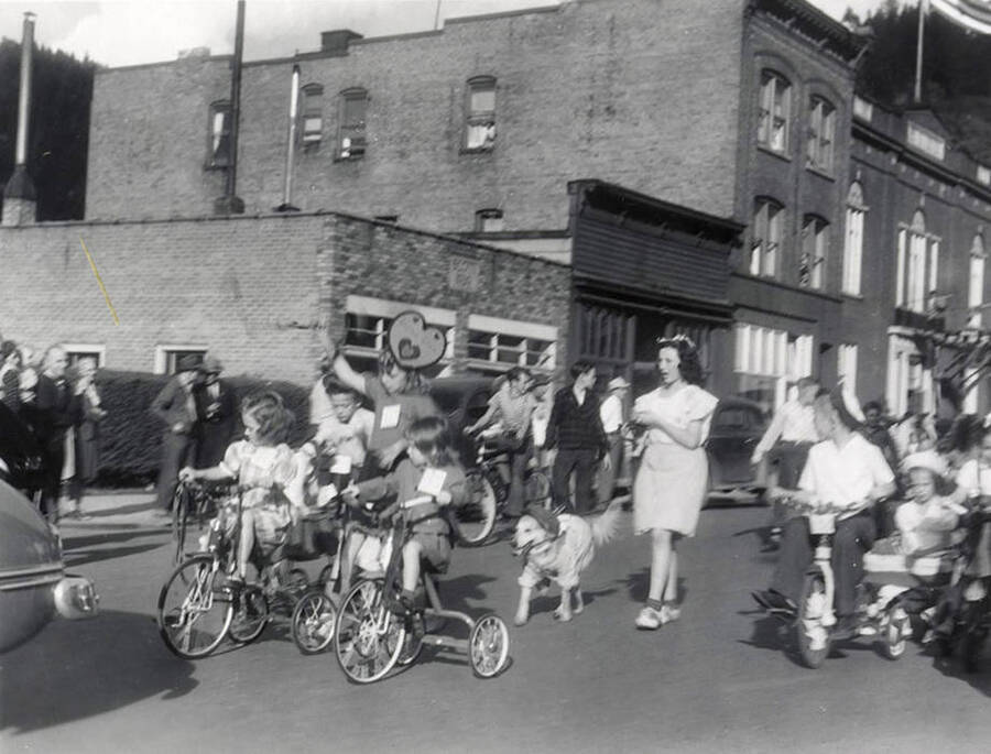 Children riding bicycles in the Children's parade during the Elks Roundup parade in Wallace, Idaho.