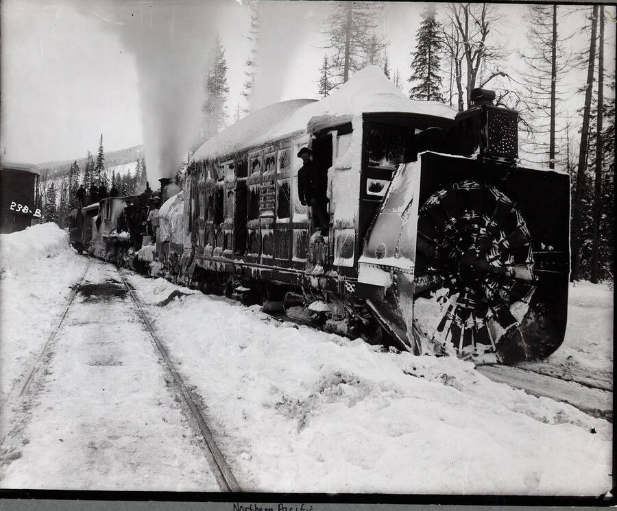Caption on front: "Snow Plow - rotary [1894] at water tank on Coeur d'Alene cut off."