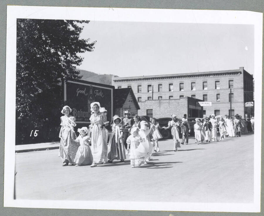 Several children wearing costumes and posing for a group photograph at the Children's Parade.