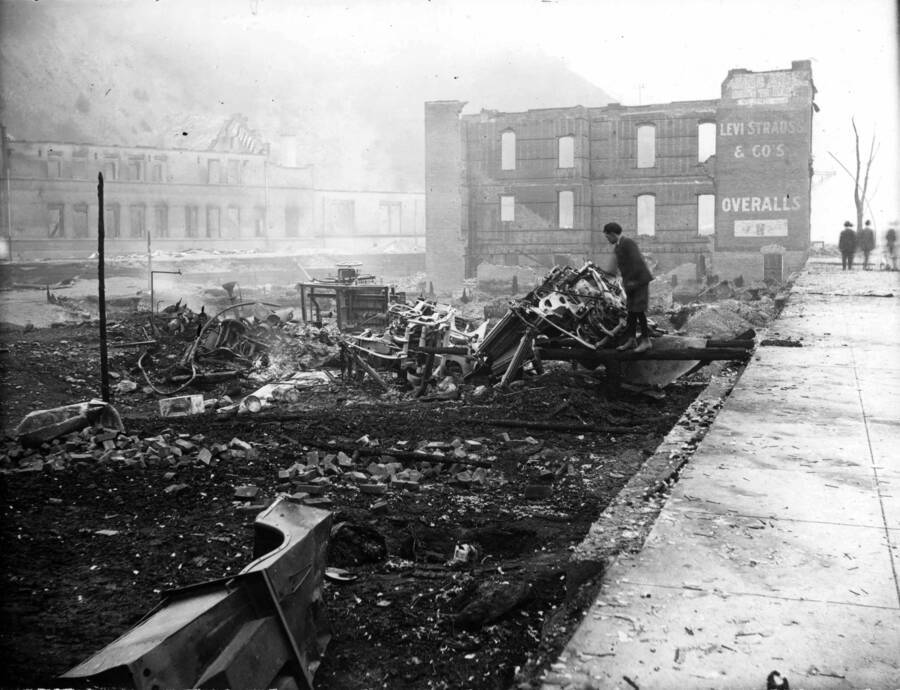 Image shows the remains of brick building at 721 Bank and, in background, O.R. & N depot, after fire of August 20, 1910.