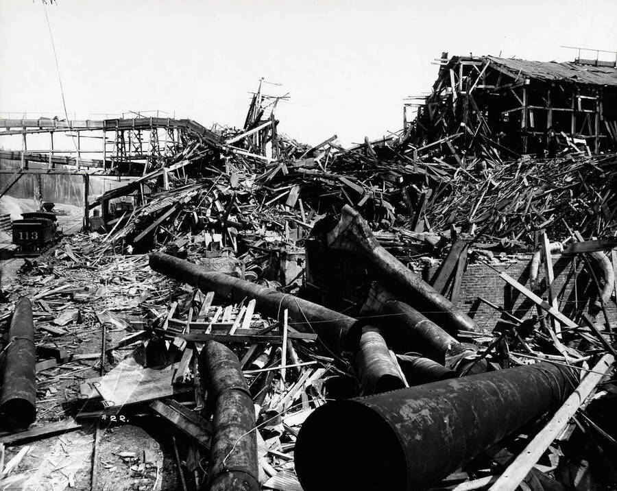 Image shows the debris of Bunker Hill and Sullivan Mill after the explosion in Wardner, Idaho [1899]. A dynamite explosion set by strikers destroyed the mill on April 29.