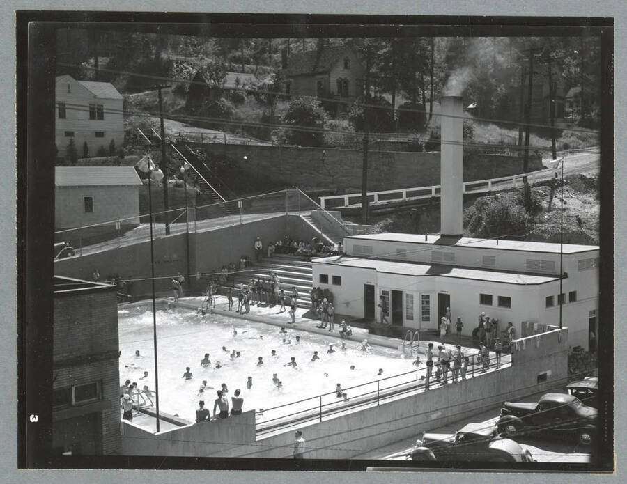 People swimming in the Wallace Swimming Pool. The pool is owned by the City of Wallace and was constructed in 1939 under a public works program of the federal government.