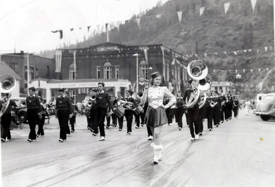 A marching band moving down the street during the Elks Round Up Parade.