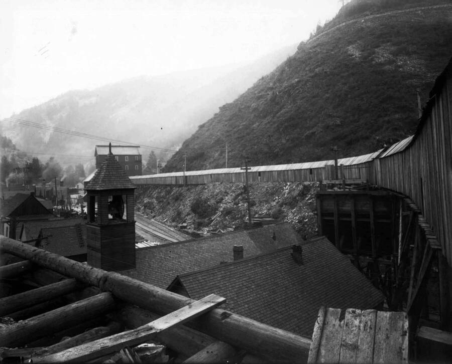 Exterior view of Marsh Mine showing roof tops of buildings and enclosed tunnel. Note bell-tower. Taken Sept. 28, 1910.