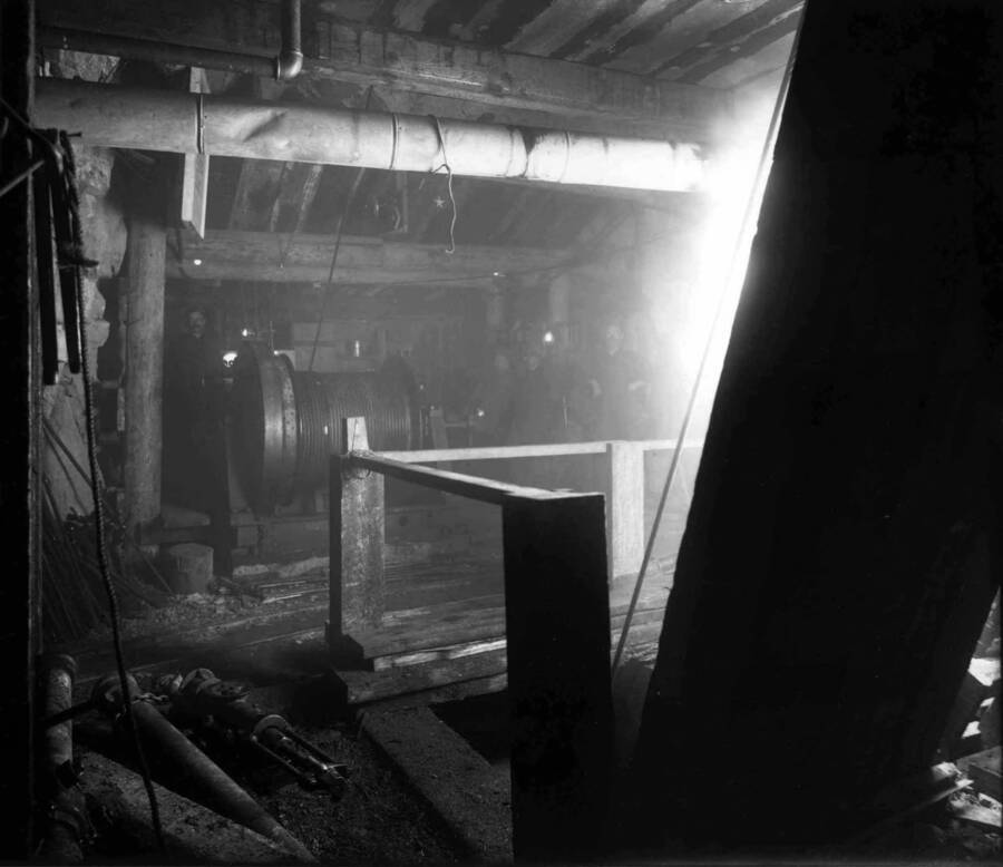 Interior view of Marsh Mine showing cable, rope, timbers & pipe. Note man standing beside cable. Taken September 28, 1910.