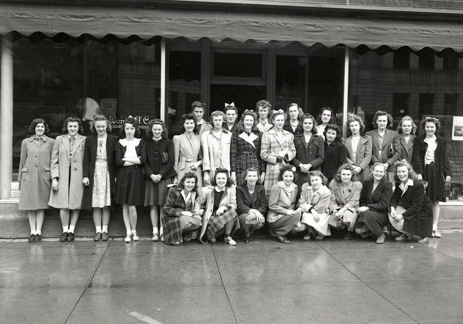 A school group posing together in front of Worstell Furniture Store in Wallace, Idaho.