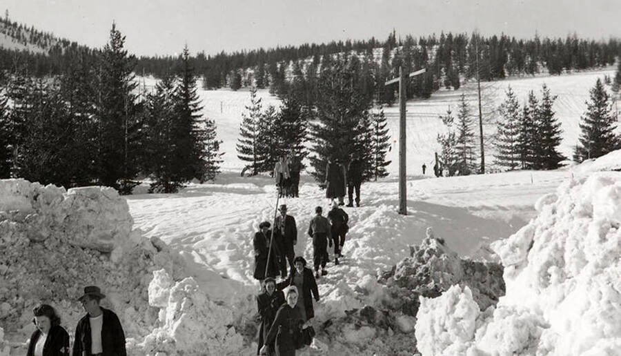 Members of the Idaho Ski Club walking through the snow at Lookout Pass in Mullan, Idaho.