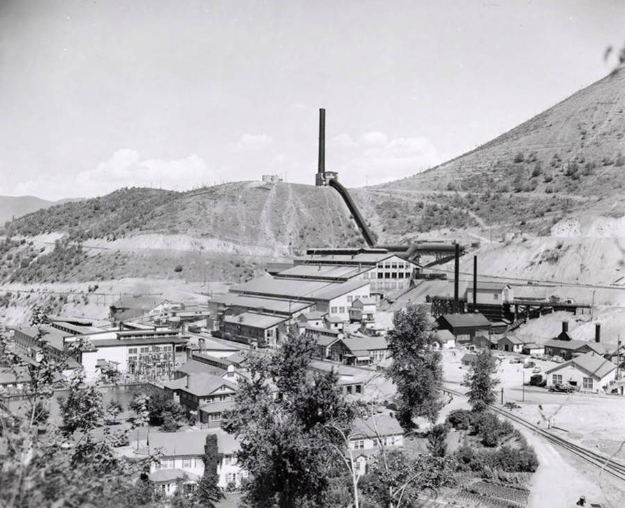 A view from afar of the Tainton Electrolytic Zinc Plant in Kellogg, Idaho. From the Library of Congress: "Internationally, this was the first electrolytic zinc plant to use U.C. Tainton's high current density, strong acid solution process to produce commercial quantities of Special High Grade Zinc (99.99+% pure). This product became the preferred material for the die-casting industry. It served as the standard that the other plants sought to achieve."