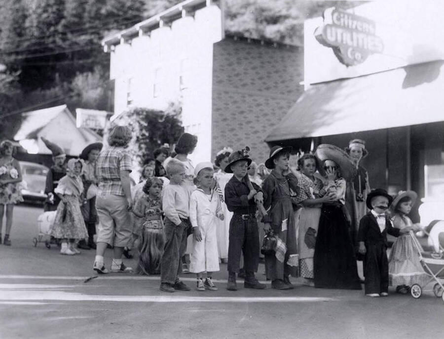 Children in costumes with homemade props during the 49'er Parade in Mullan, Idaho.
