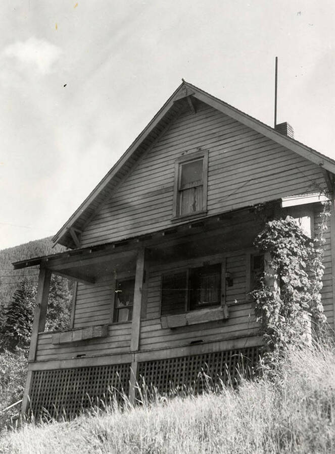 A photograph of a home in Wallace, Idaho, taken for J.A. Peterson Real Estate Company.