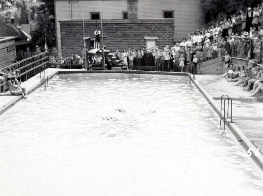 A crowd gathered around the community pool to watch the Swimming Competition during the 49'er Parade in Mullan, Idaho.