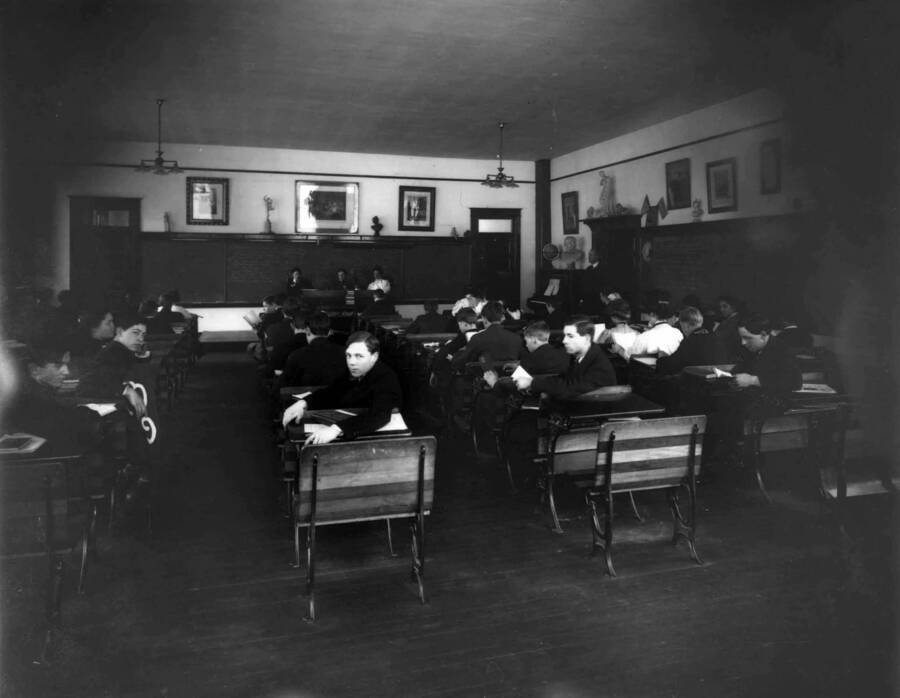 Classroom with students sitting at desks in Wallace High School, photo was taken in April 1909.