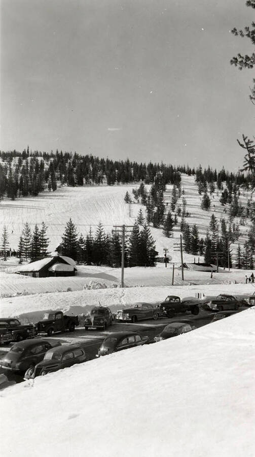 A view cars parked along the main road coming into the ski lodge at Lookout Pass in Mullan, Idaho.