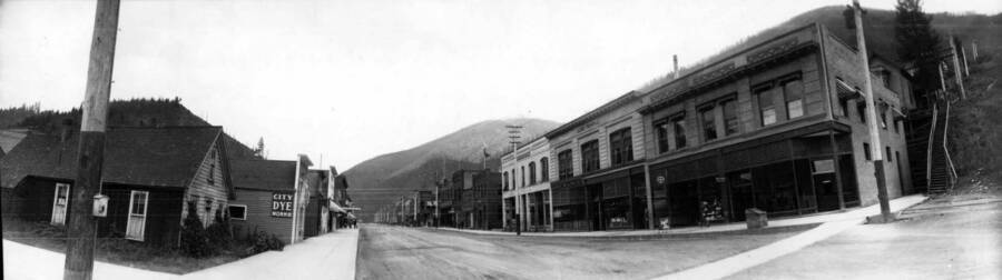 View of street looking into town. Panoramic photograph of Wallace, Idaho.