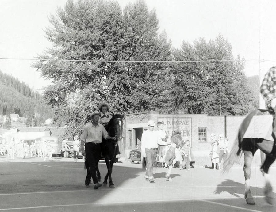 Children riding horses in the Mullan 49'er Parade in Mullan, Idaho.
