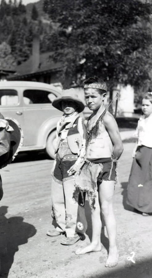 Two children in costume during the 49'er Parade in Mullan, Idaho.