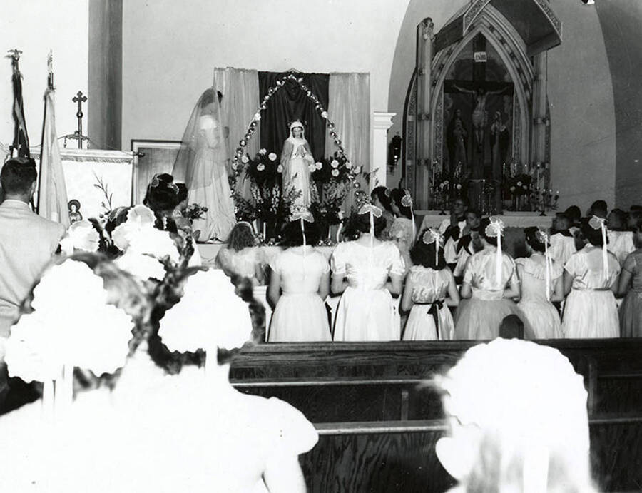 Children participating in the crowning of Virgin Mary at Our Lady of Lourdes Academy in Wallace, Idaho.