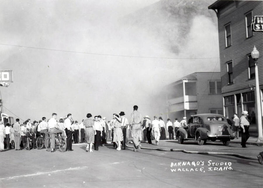 A crowd gathers around the garage fire on Residence Street in Wallace, Idaho.