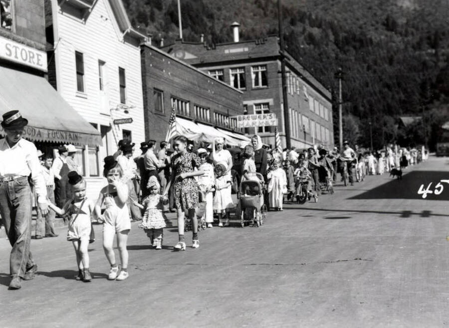 Children in costume marching along during the 49'er Parade in Mullan, Idaho.