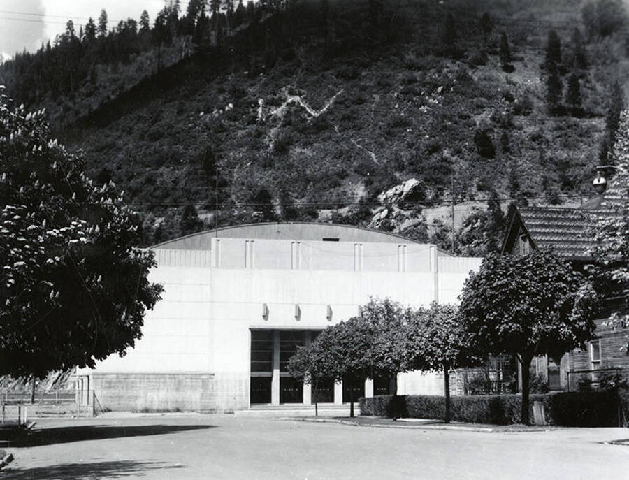 Exterior view of Memorial Stadium in Wallace, Idaho. The Wallace "W" can be seen on the hillside behind the stadium.