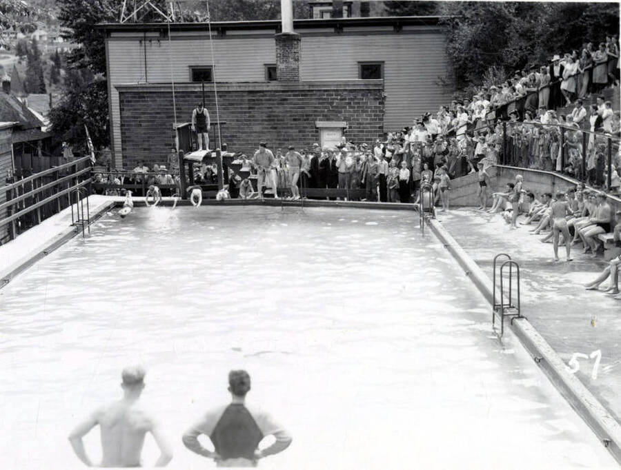 A crowd gathered around the community pool to watch the Swimming Competition during the 49'er Parade in Mullan, Idaho.