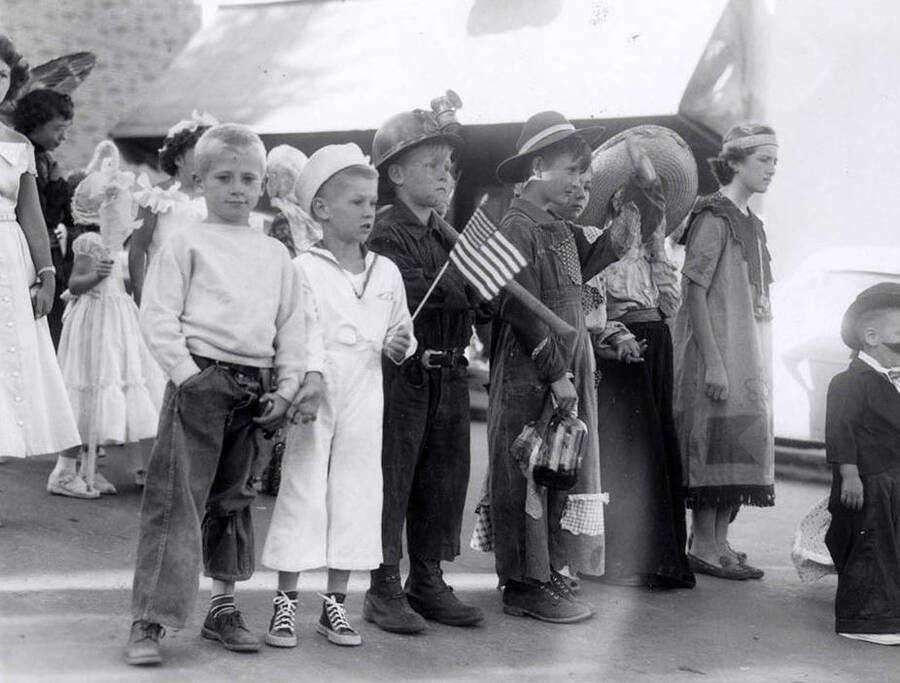 Children in costumes with homemade props during the 49'er Parade in Mullan, Idaho.