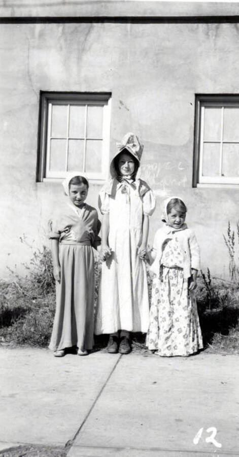 Three children in costume during the 49'er Parade in Mullan, Idaho.