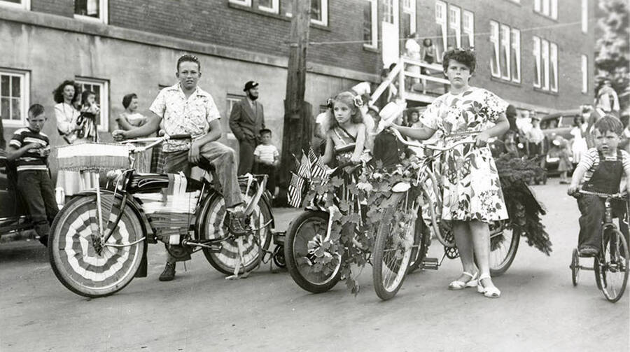Children on decorated bikes during the 49'er Parade in Mullan, Idaho.