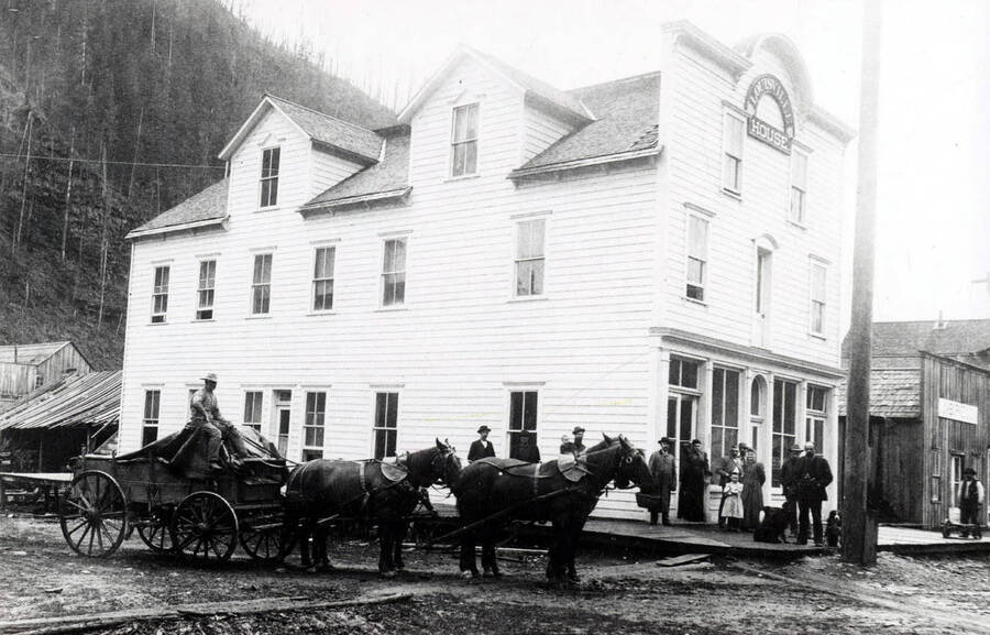 A horse-drawn carriage in front of the Louisville House in Murray, Idaho.