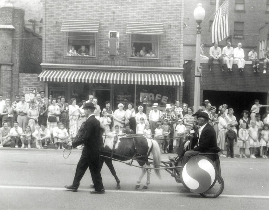 A horse pulling a cart in the Jubilee parade in Wallace, Idaho.