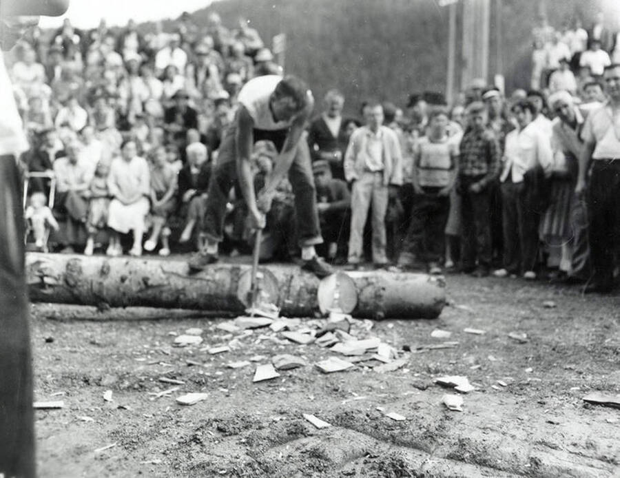 Men participating in a logging contest during the Jubilee parade in Wallace, Idaho.