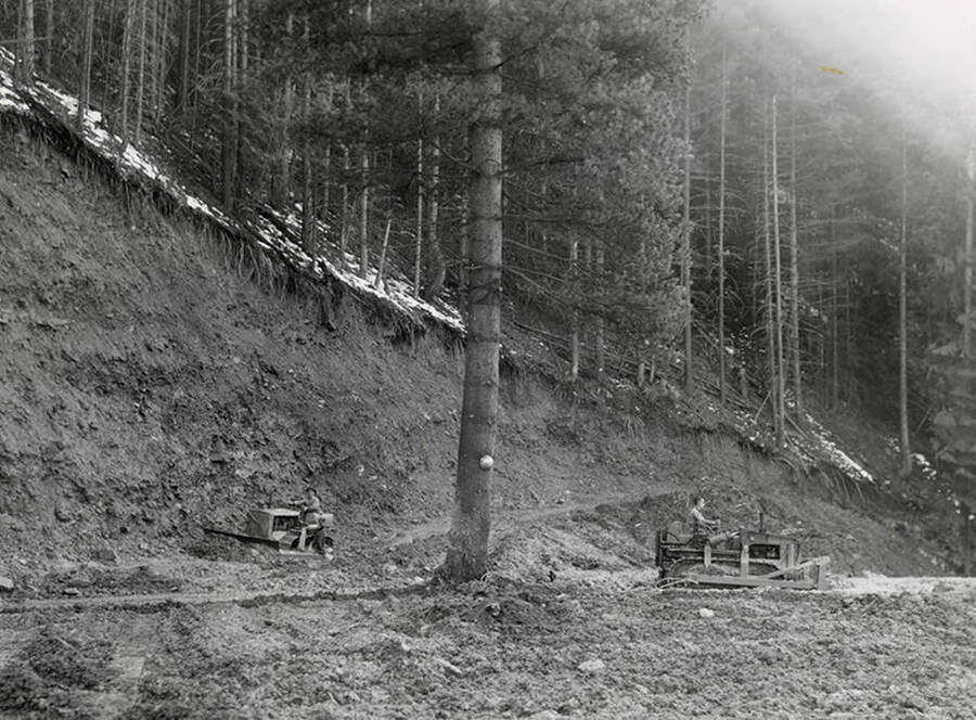 Men working with bulldozers at the mine on Rock Creek, west of Mullan, Idaho.