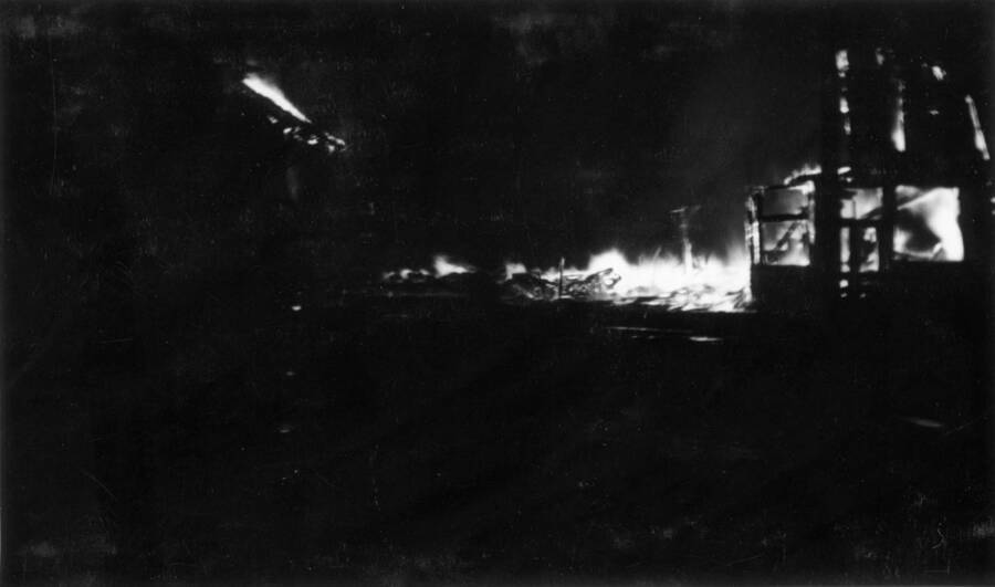 Night time image of the fire burning buildings in Wallace, Idaho. Forest fire 1910.