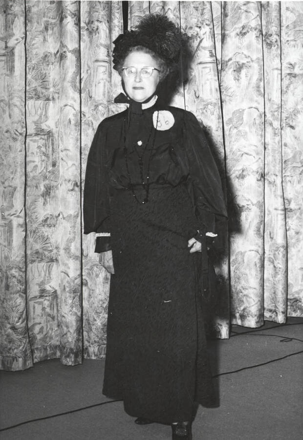 Informal portrait of a lady wearing a turn of the century outfit in the fashion portion at the North Idaho Press Jubilee.