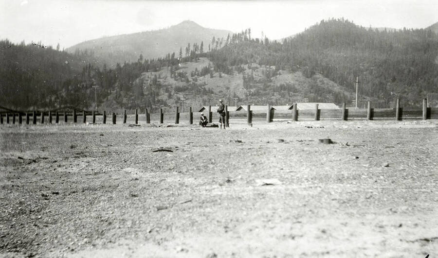 The Sunnyside Addition in Kellogg, Idaho during the flood of 1933. Two men can be seen standing by a fence.