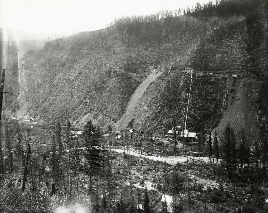 View of Rockford Placer at Prichard Creek, which is located on the north side of the Coeur d'Alene Mining District. Buildings can be seen at the bottom of the hill.