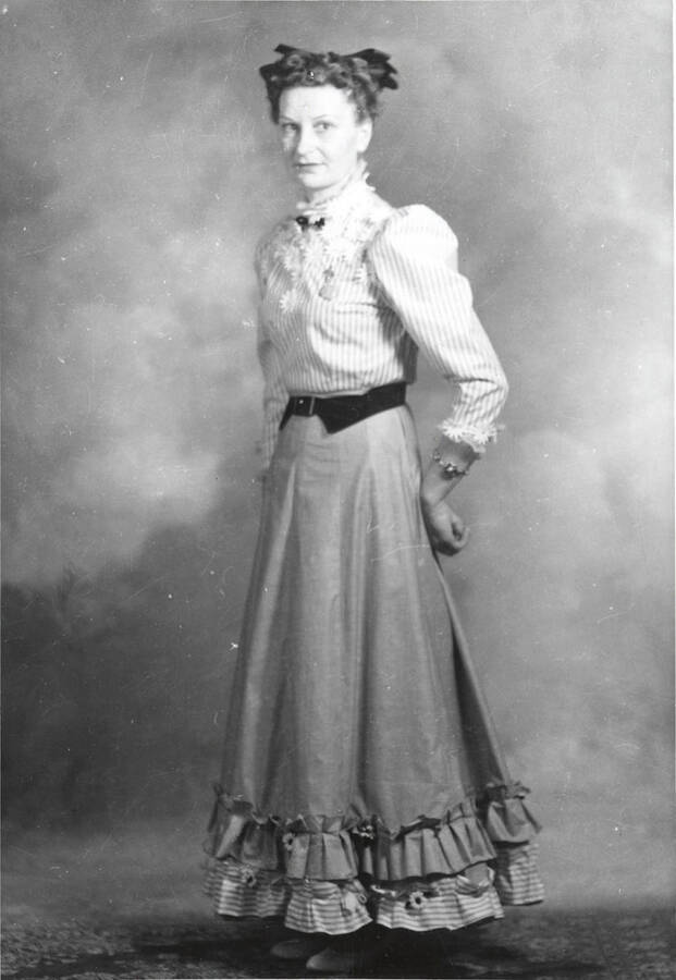 Formal portrait of a woman in fashion dress at the North Idaho Press Jubilee.