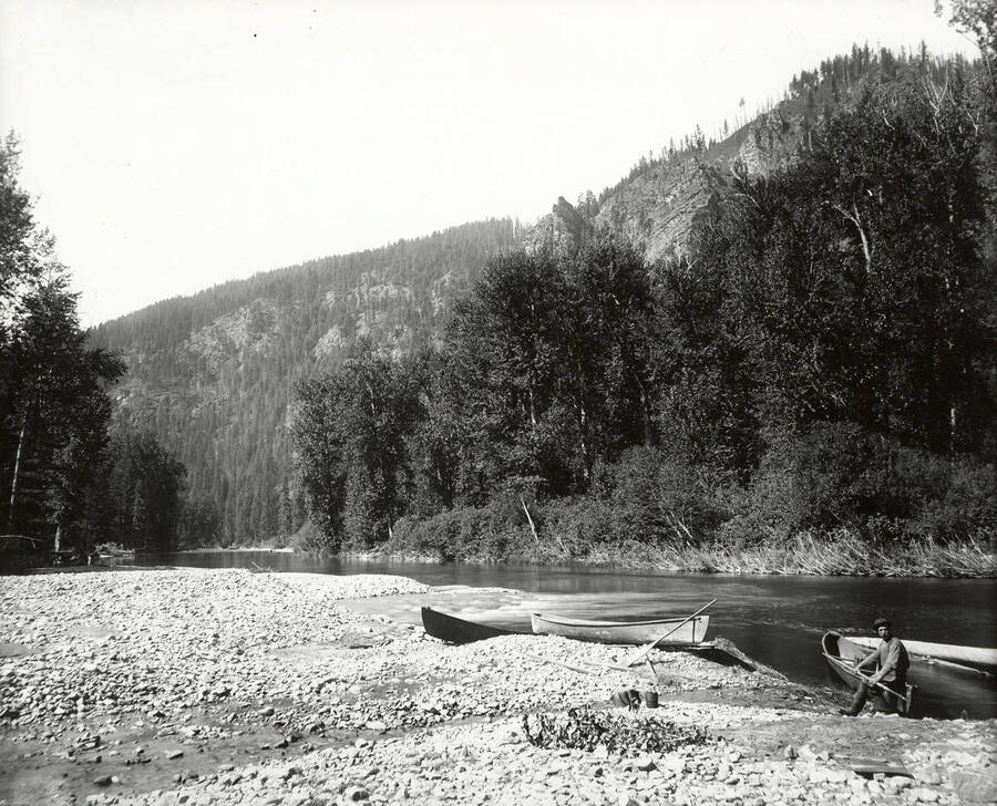 Canoes on the bank at the mouth of Prichard Creek, near North Fork by the Coeur d'Alene Mining District.