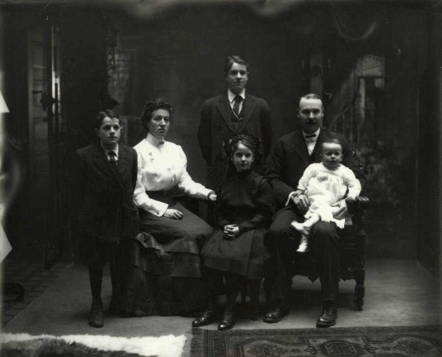Family photo of Mr. and Mrs. Newell and their four children. William Newell can be seen pictured with the group.