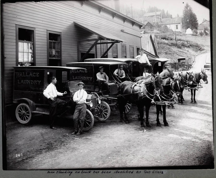 Truck and Horse drawn laundry wagons outside the laundry in Wallace, Idaho.