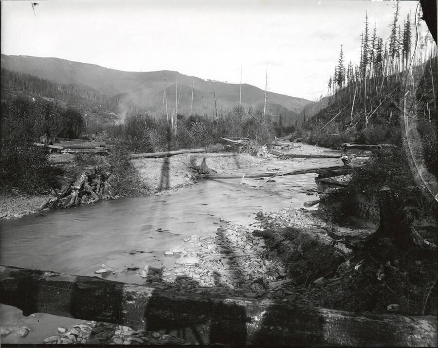 North side, Coeur d'Alene Mining District (Murray area). The legs of the camera stand are visible in the shadows on the water in the bottom portion of the photograph.