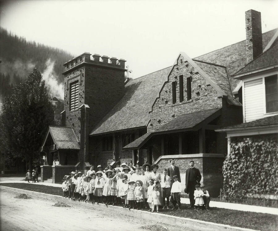 Group photo of the Sunday school group of the Holy Trinity Episcopal Church in Wallace, Idaho. The church is located at 4th and Cedar Street.