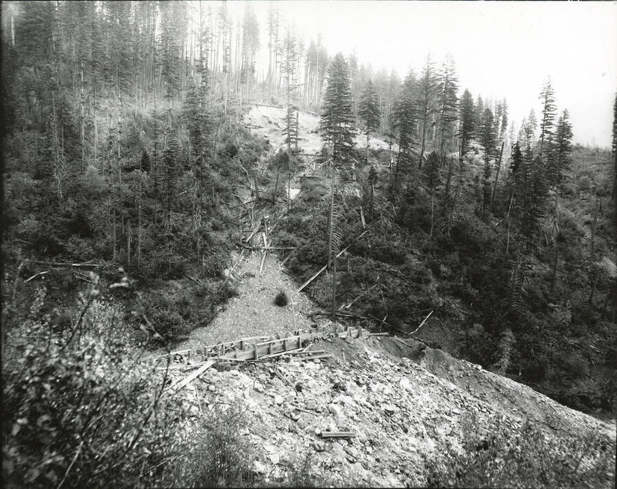 North side, Coeur d'Alene Mining District (Beaver Creek area). The wooden flume is visible across the photograph.