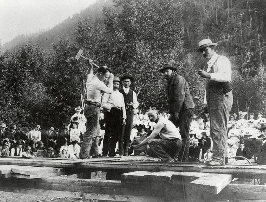 A group of men participating in a singlejacking contest during Labor Day in Murray, Idaho. Walter Jay, driller; Walter Keister, Chas. Craven, time keeper; Jess Kesi,driller; pete Spaulding; Ed Collengen, time keeper.